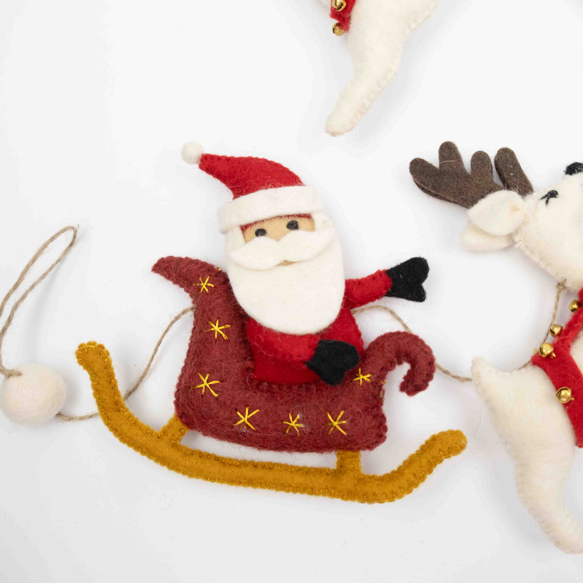 Santa with Sleigh and 7 White Reindeer Garland